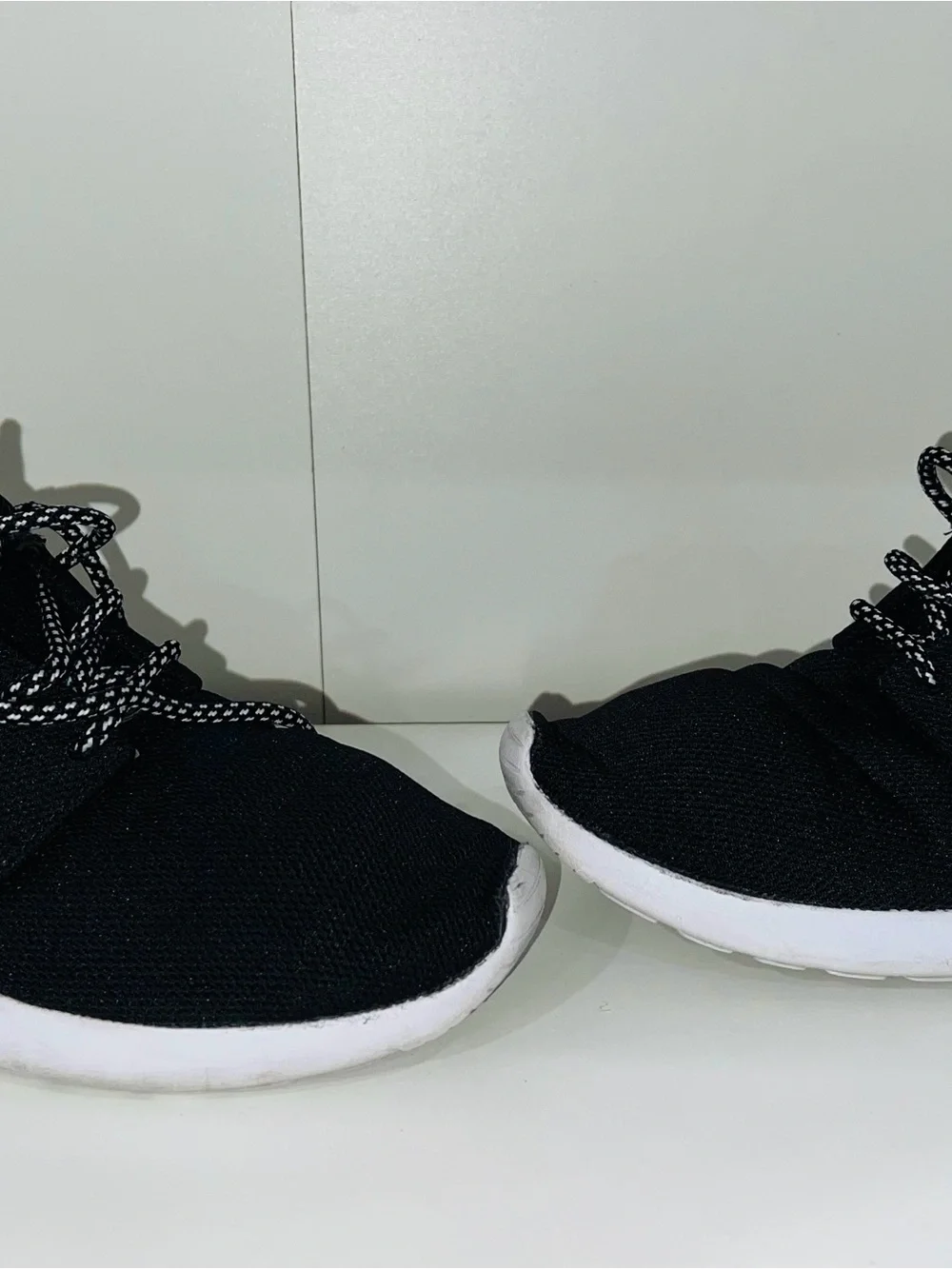 Nike Men’s Black Sneakers with White Swoosh and White Sole